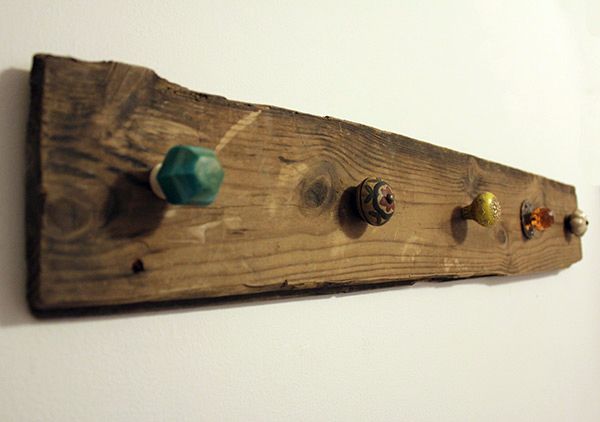 Screw cheap furniture knobs into wood for a necklace holder