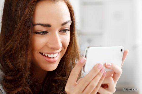 Pretty young woman using mobile phone