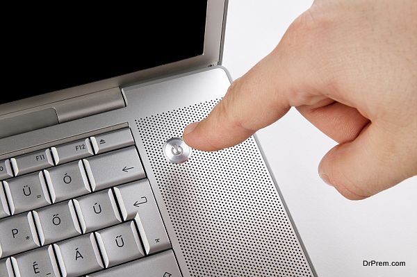 Pushing the Power Button on Laptop Computer